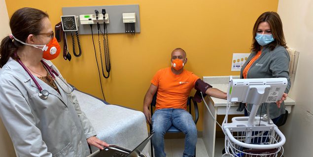 A patient getting his blood pressure checked as Esperanza Health Center.