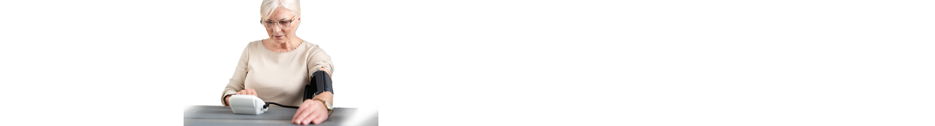 Woman taking her blood pressure at home.