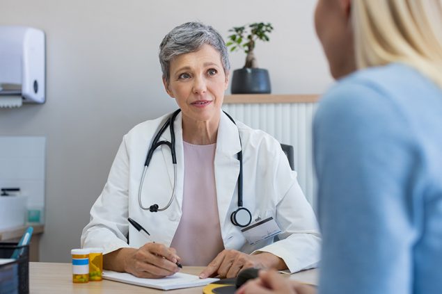 A physician speaking to her patient about the medication she's prescribing to her.