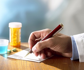 Doctor writing prescription Physician writing a prescription.